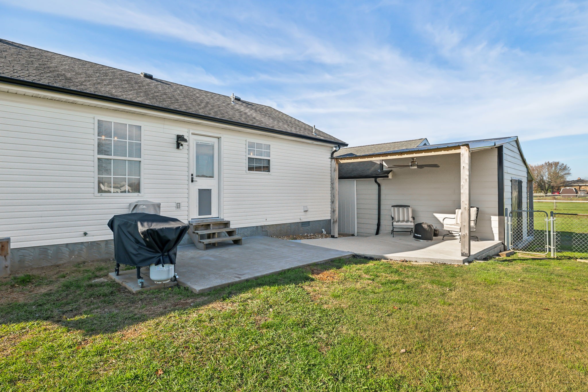 1055 Anderton Road Bell Buckle, TN 37020 - Photo 27 of 51 a backyard of a house with seating space