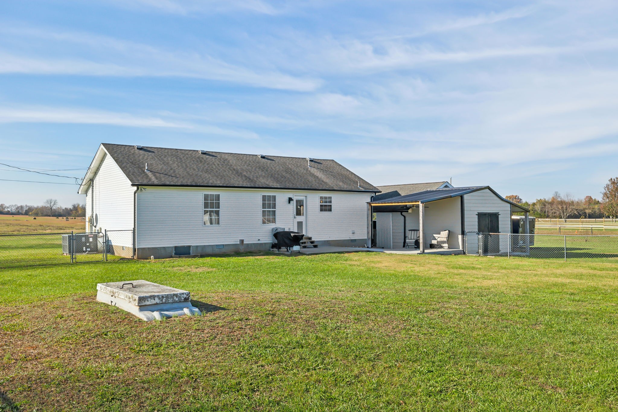 1055 Anderton Road Bell Buckle, TN 37020 - Photo 29 of 51 a view of a house with a big yard and large trees