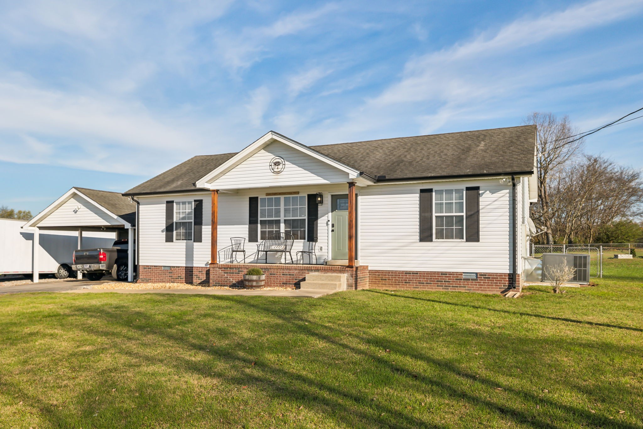 1055 Anderton Road Bell Buckle, TN 37020 - Photo 3 of 51 a front view of a house with a yard table and chairs