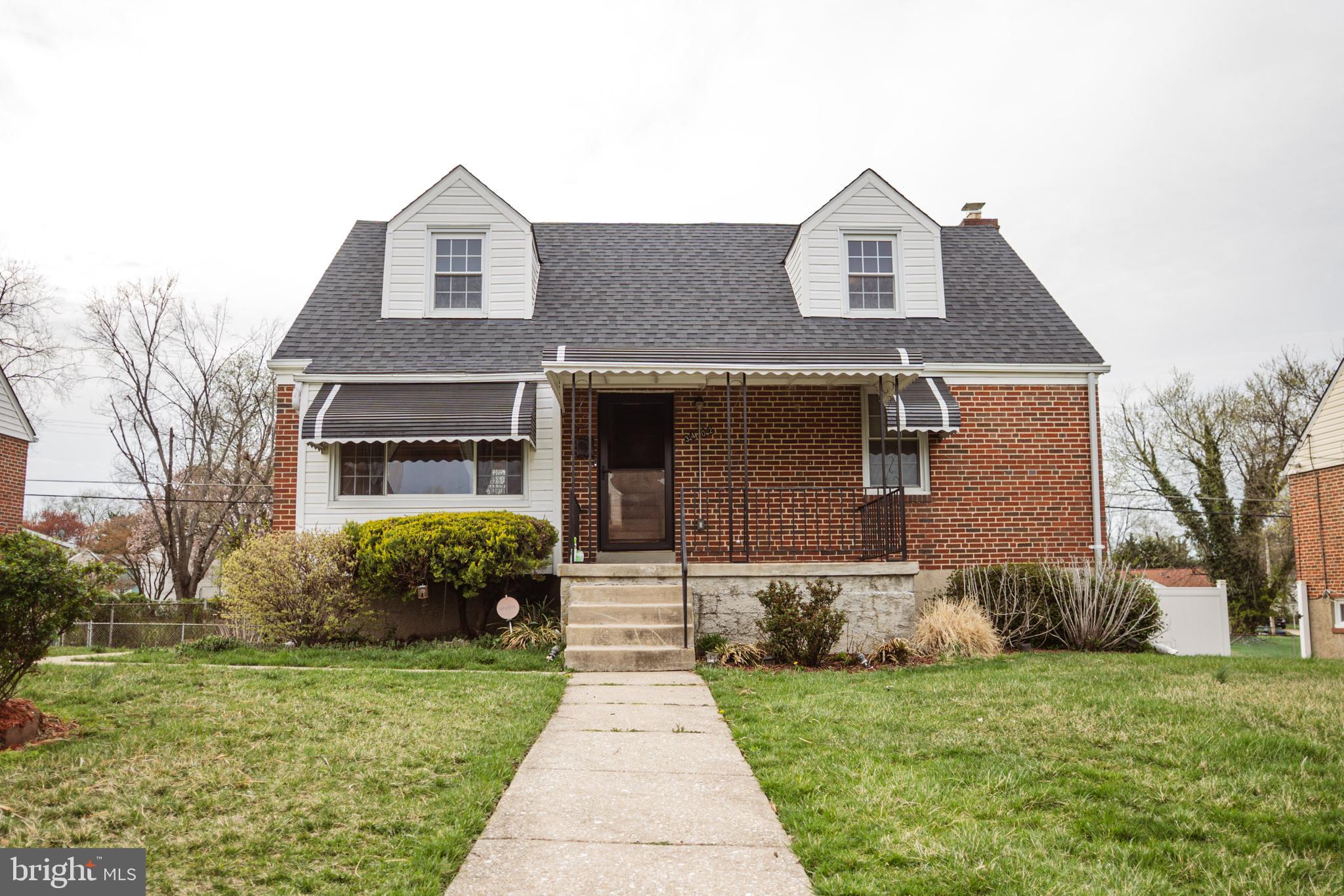3402 Mayfair Road Baltimore, MD 21207 - Photo 1 of 48 a front view of a house with a garden