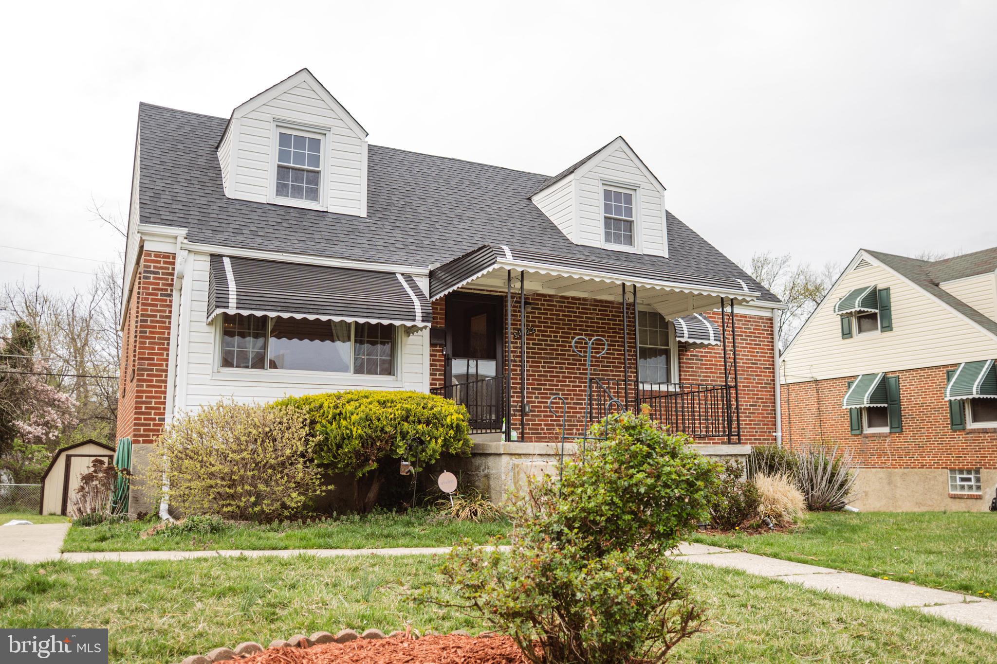3402 Mayfair Road Baltimore, MD 21207 - Photo 2 of 48 a front view of a house with a yard