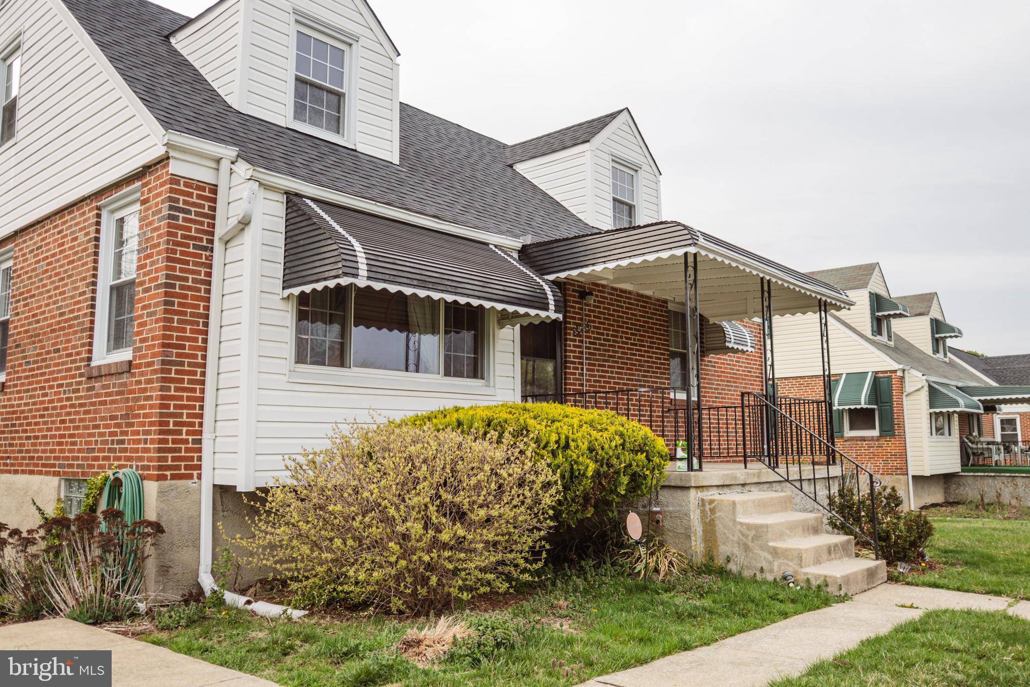 3402 Mayfair Road Baltimore, MD 21207 - Photo 3 of 48 a front view of a house with garden