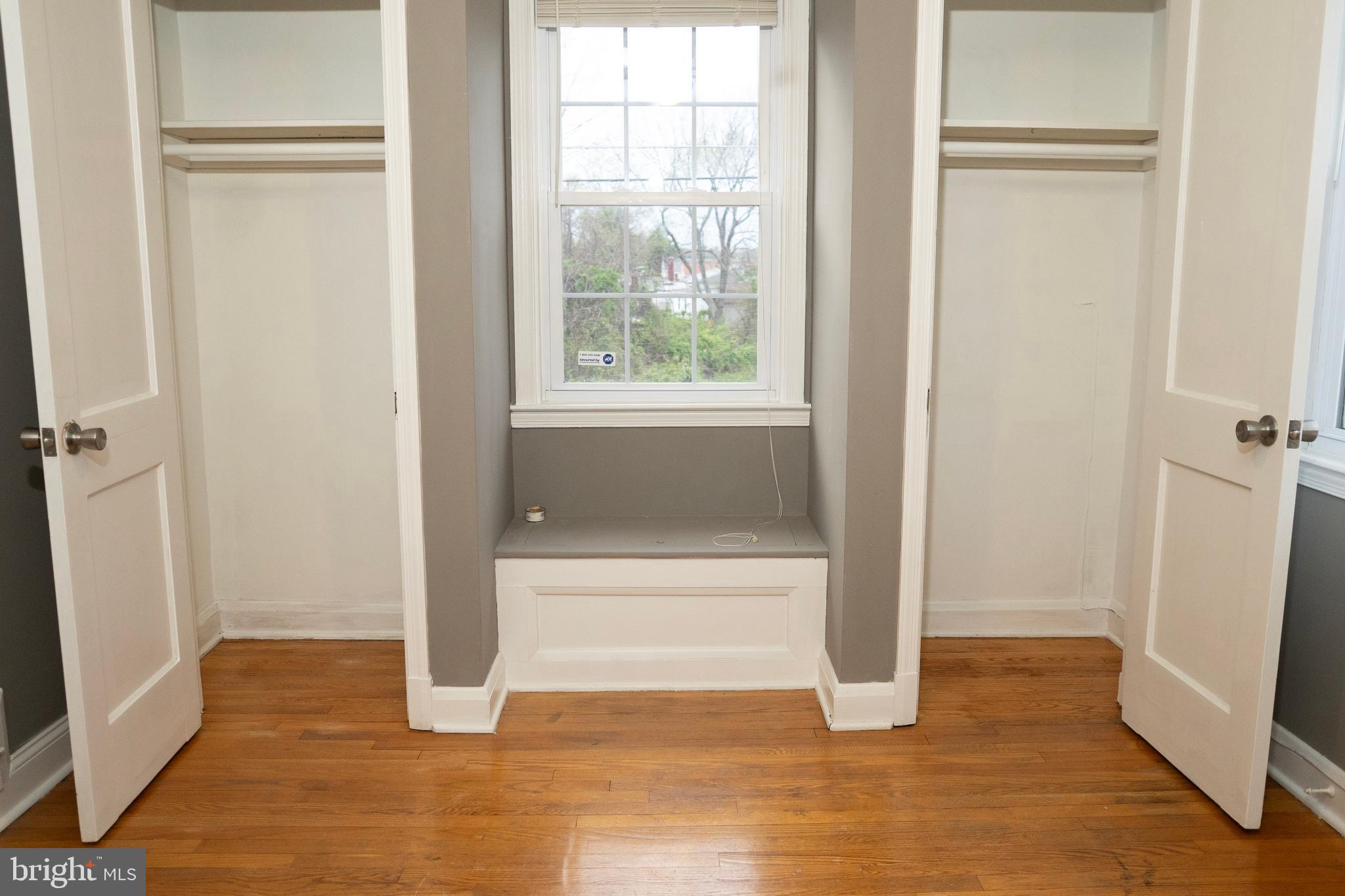 3402 Mayfair Road Baltimore, MD 21207 - Photo 32 of 48 a view of an empty room with wooden floor and a window