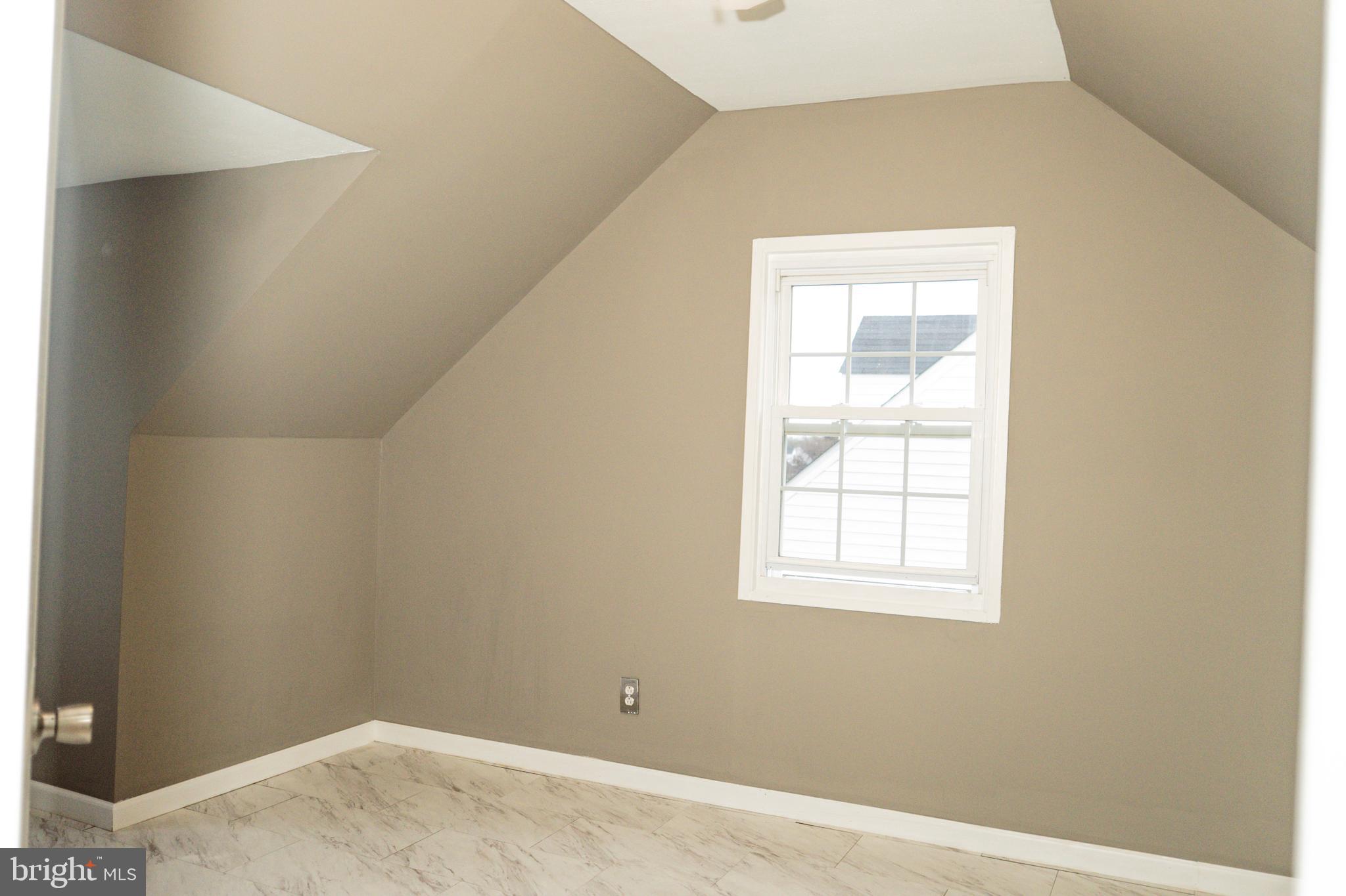 3402 Mayfair Road Baltimore, MD 21207 - Photo 34 of 48 an empty room with a window