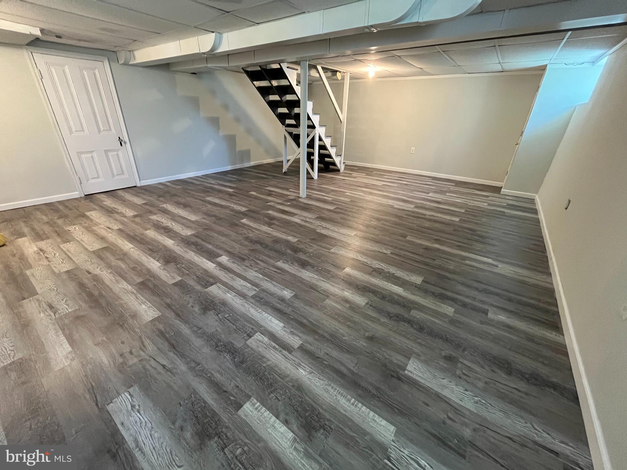 3402 Mayfair Road Baltimore, MD 21207 - Photo 39 of 48 a view of empty room with wooden floor