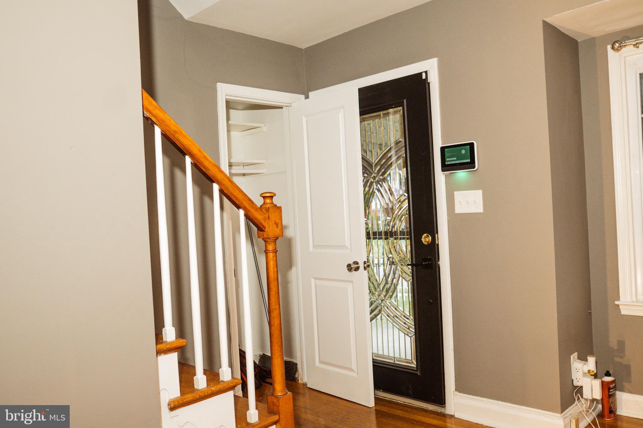 3402 Mayfair Road Baltimore, MD 21207 - Photo 6 of 48 a view of a hallway with wooden floor and staircase