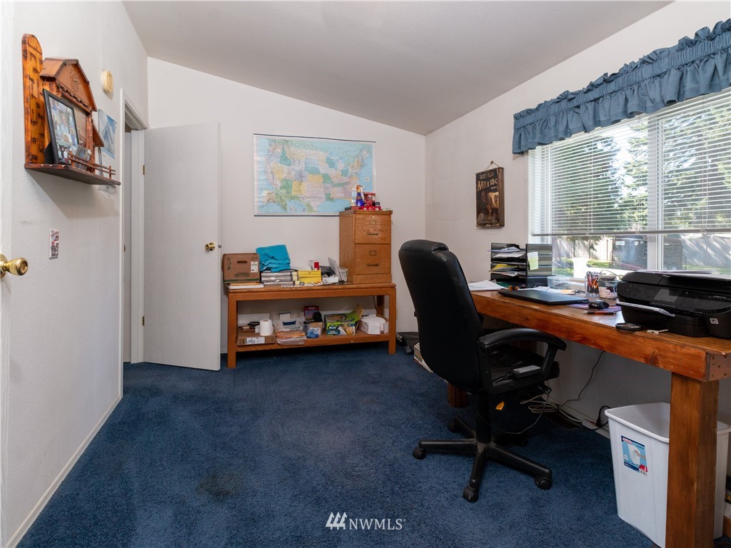 5004 186th Lane Southwest Rochester, WA 98579 - Photo 13 of 27 a bedroom with a workspace