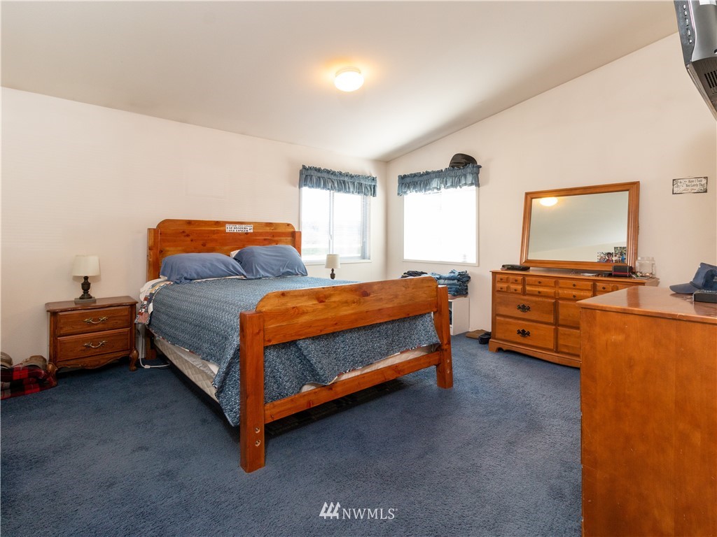 5004 186th Lane Southwest Rochester, WA 98579 - Photo 14 of 27 a bedroom with a bed and a view of bedroom