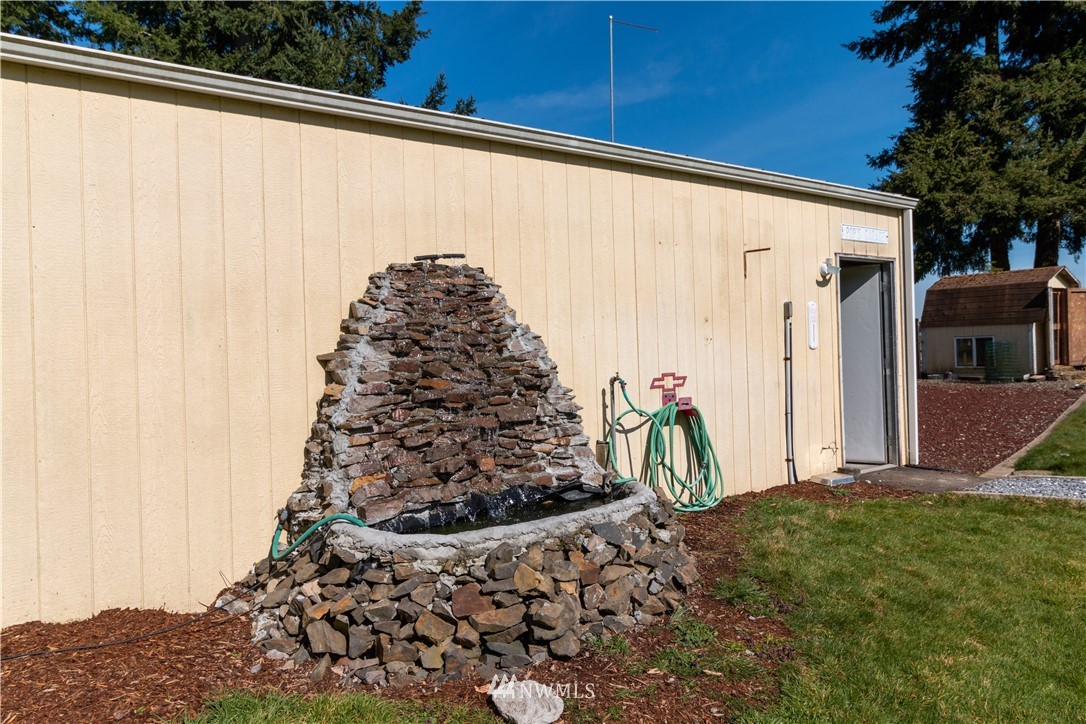 5004 186th Lane Southwest Rochester, WA 98579 - Photo 20 of 27 a view of a backyard of the house