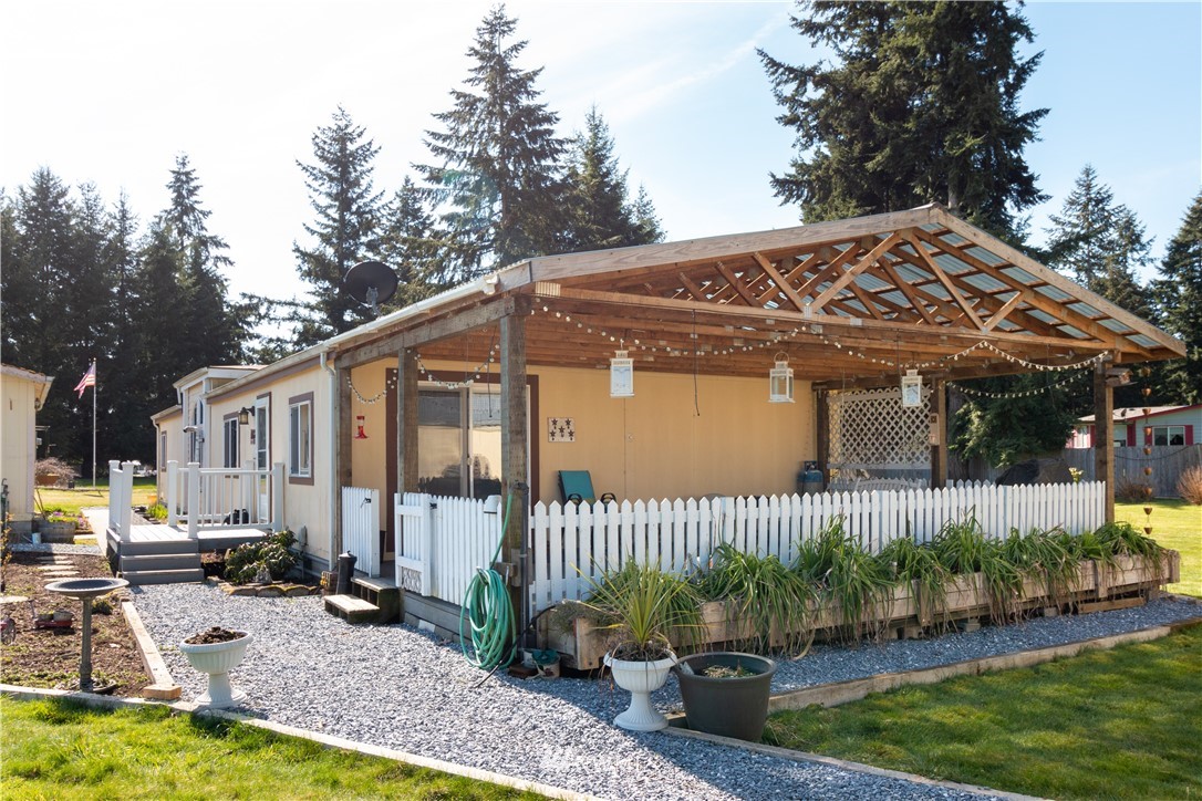 5004 186th Lane Southwest Rochester, WA 98579 - Photo 22 of 27 a front view of a house with garden