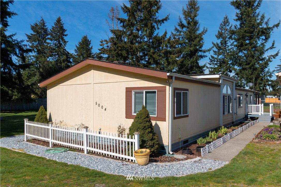 5004 186th Lane Southwest Rochester, WA 98579 - Photo 23 of 27 a view of a house with backyard and garden
