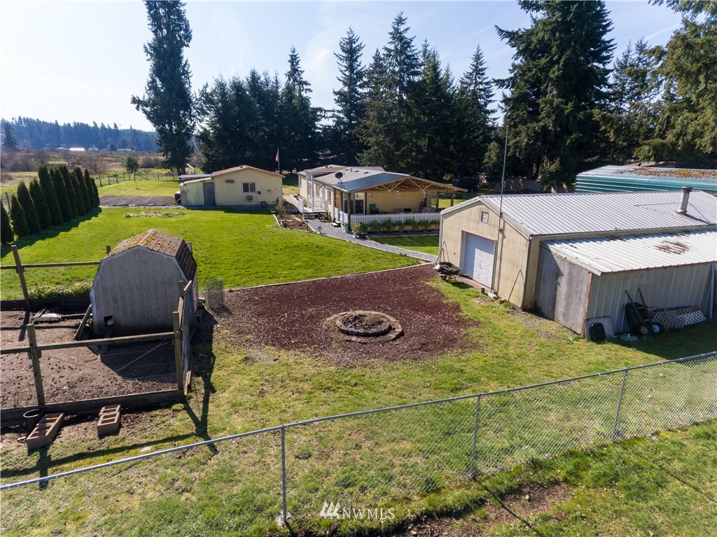 5004 186th Lane Southwest Rochester, WA 98579 - Photo 25 of 27 a view of a swimming pool with lawn chairs
