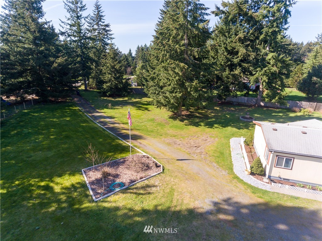 5004 186th Lane Southwest Rochester, WA 98579 - Photo 26 of 27 a view of a swimming pool with a yard