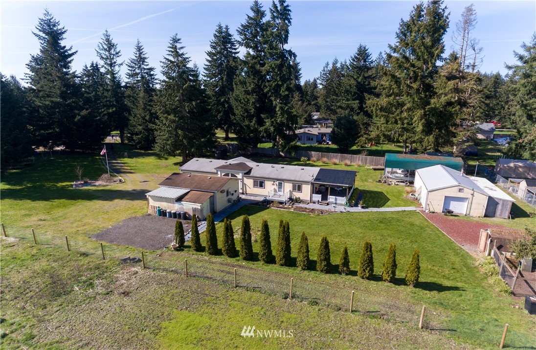 5004 186th Lane Southwest Rochester, WA 98579 - Photo 4 of 27 a view of a house with garden space and sitting area