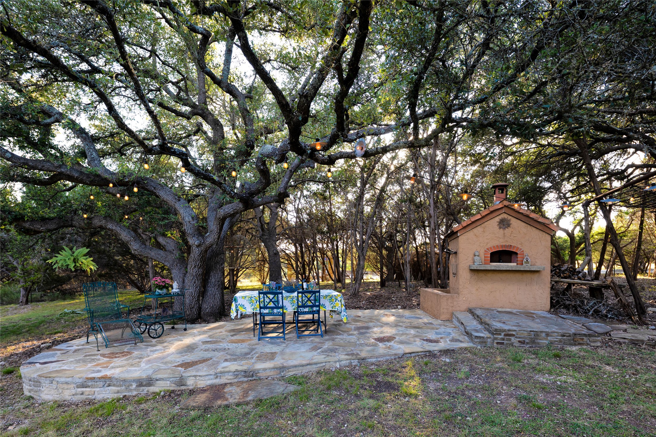 5818 Ranch Road 165, Unit TRACT 1 Blanco, TX 78606 - Photo 25 of 40 Pizza oven and dining area