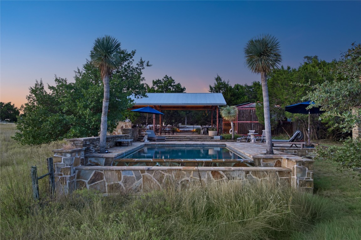 5818 Ranch Road 165 Blanco, TX 78606 - Photo 36 of 40 Pool and pavilion with kitchen