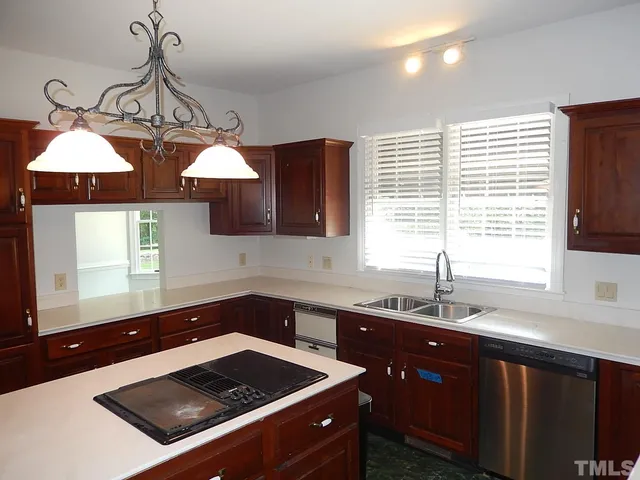 a room with window and chandelier