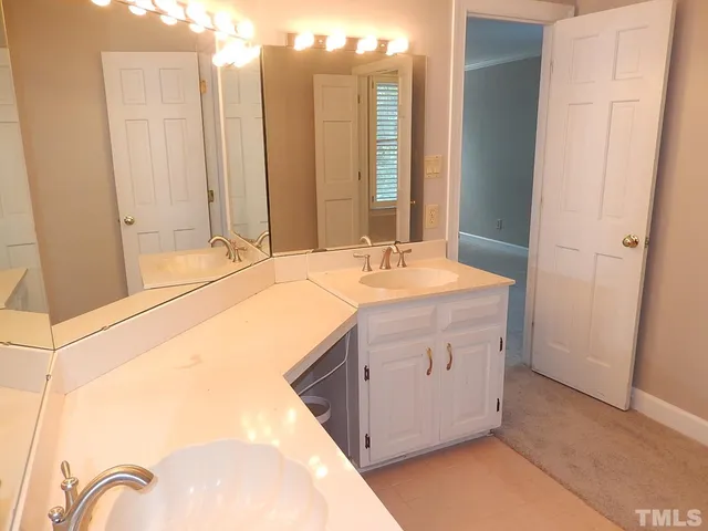 a bathroom with a glass shower door