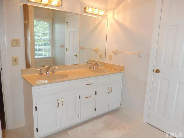 a room with a cabinet and a window