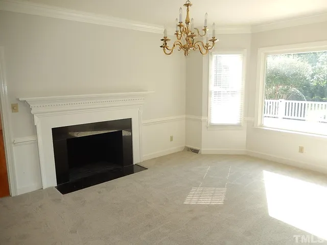 a living room with a fireplace