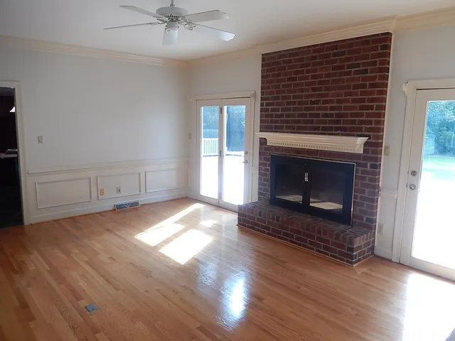 a kitchen with stainless steel appliances granite countertop a refrigerator and a stove