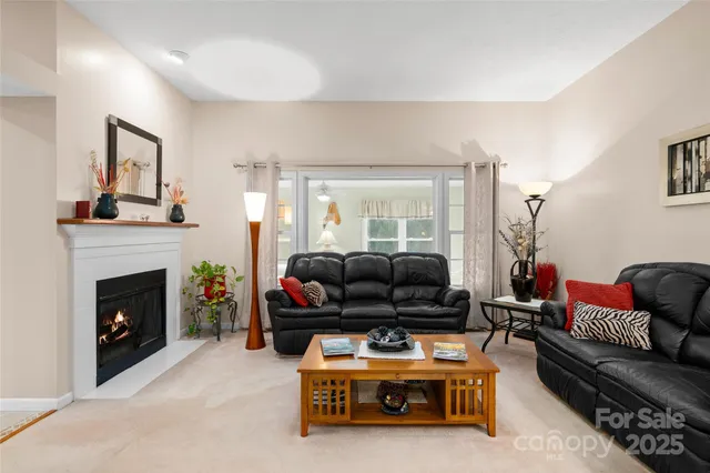 a living room with furniture a lamp and a couch
