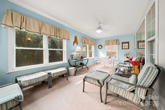 a dining room with furniture and window