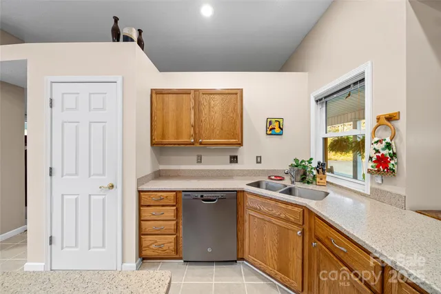 a bedroom with a bed chair and a large window