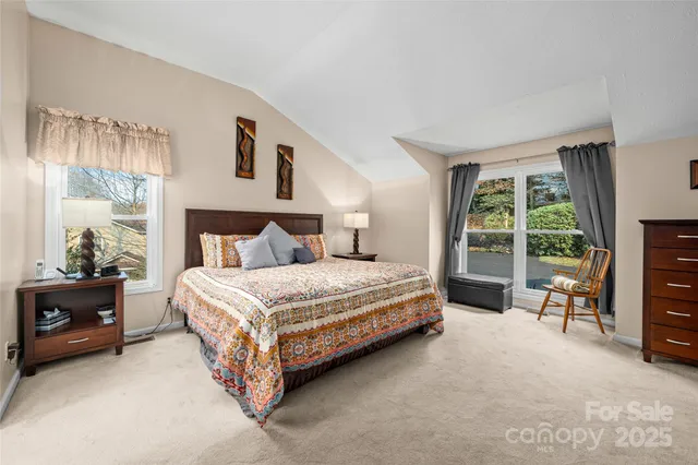 a bedroom with a bed and a night stand