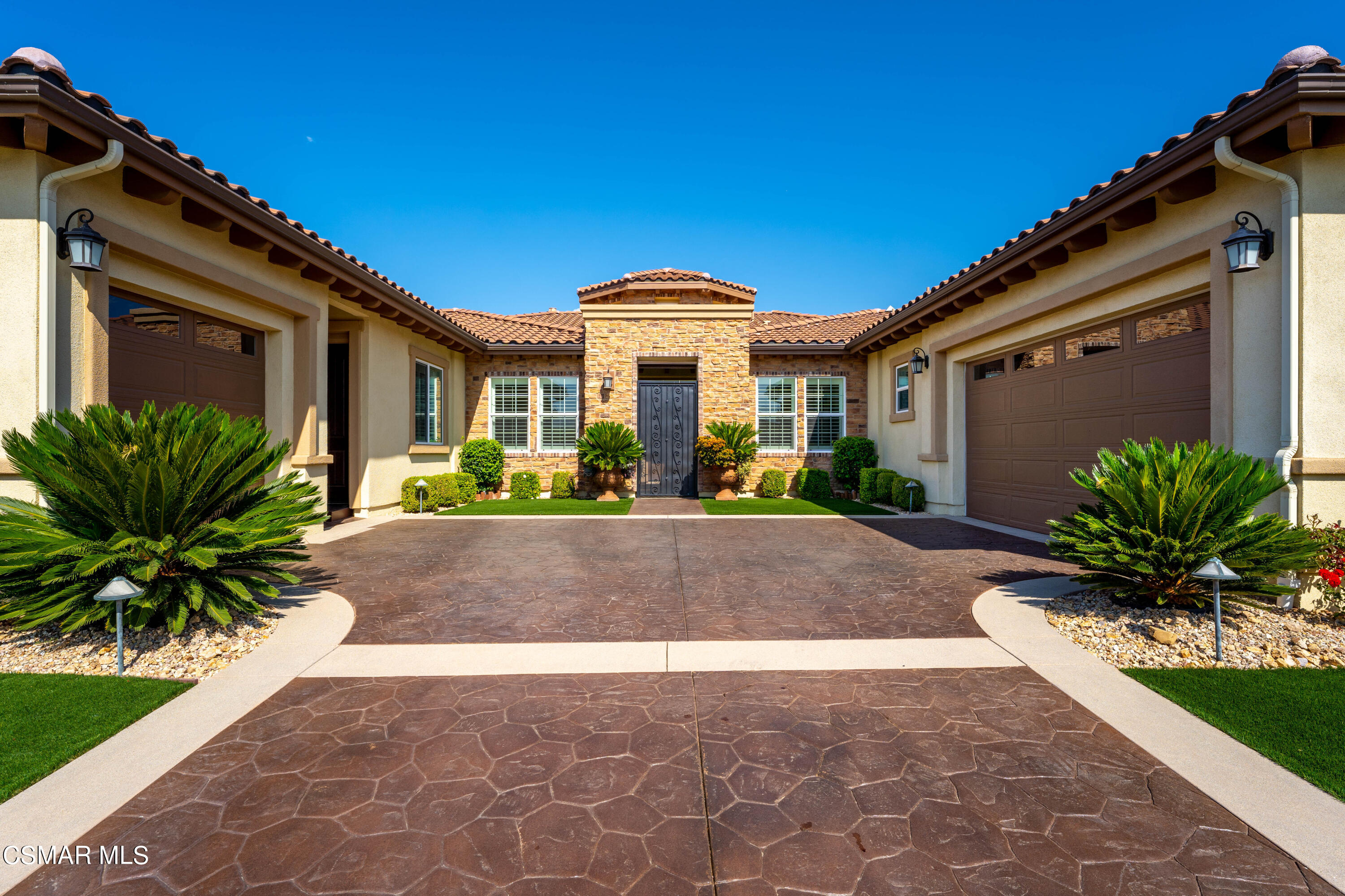 7343 Nicklaus Road Moorpark, CA 93021 - Photo 3 of 42 a front view of a house with a yard