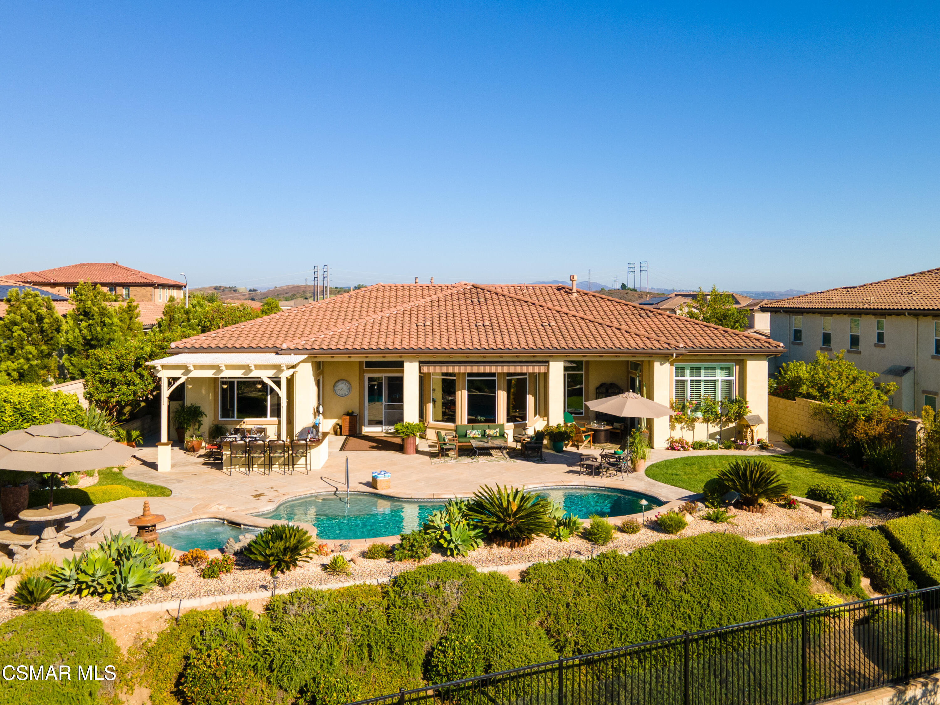 7343 Nicklaus Road Moorpark, CA 93021 - Photo 33 of 42 a view of a house with swimming pool and chairs