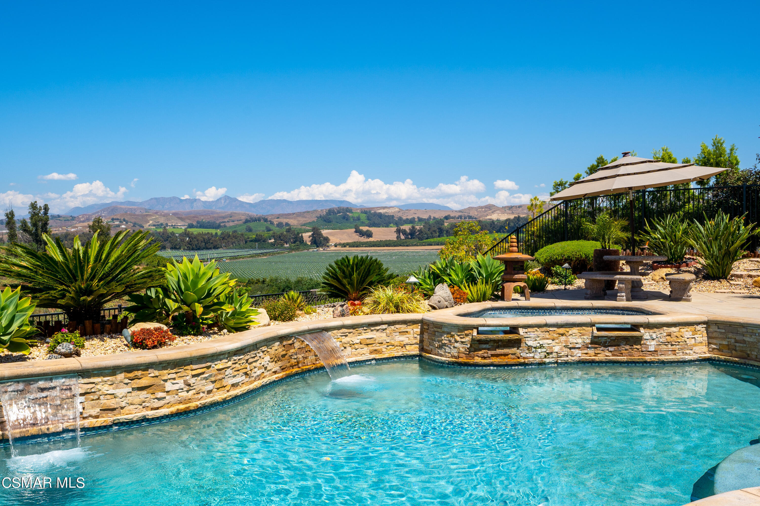 7343 Nicklaus Road Moorpark, CA 93021 - Photo 36 of 42 a view of a swimming pool with a yard and sitting area