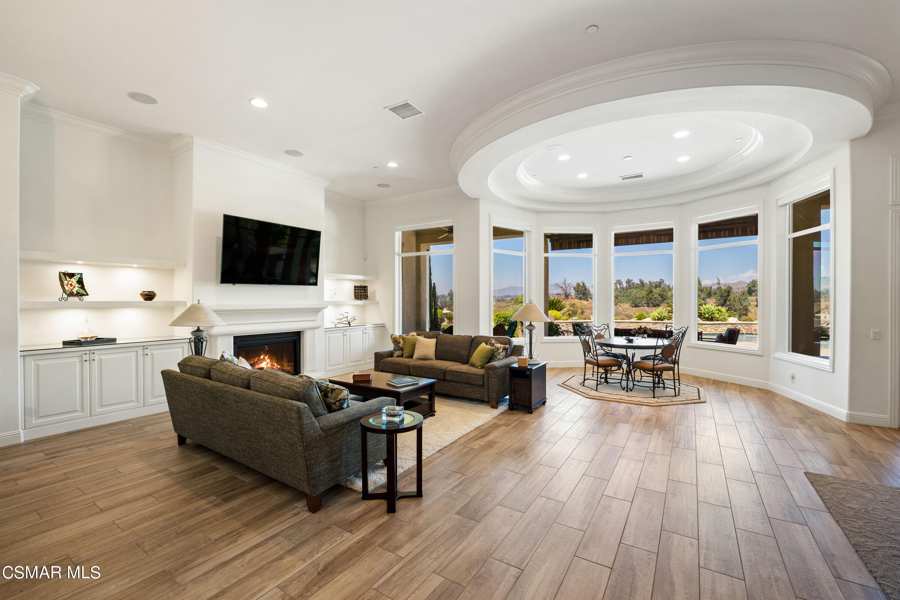 7343 Nicklaus Road Moorpark, CA 93021 - Photo 5 of 42 a living room with furniture and a flat screen tv