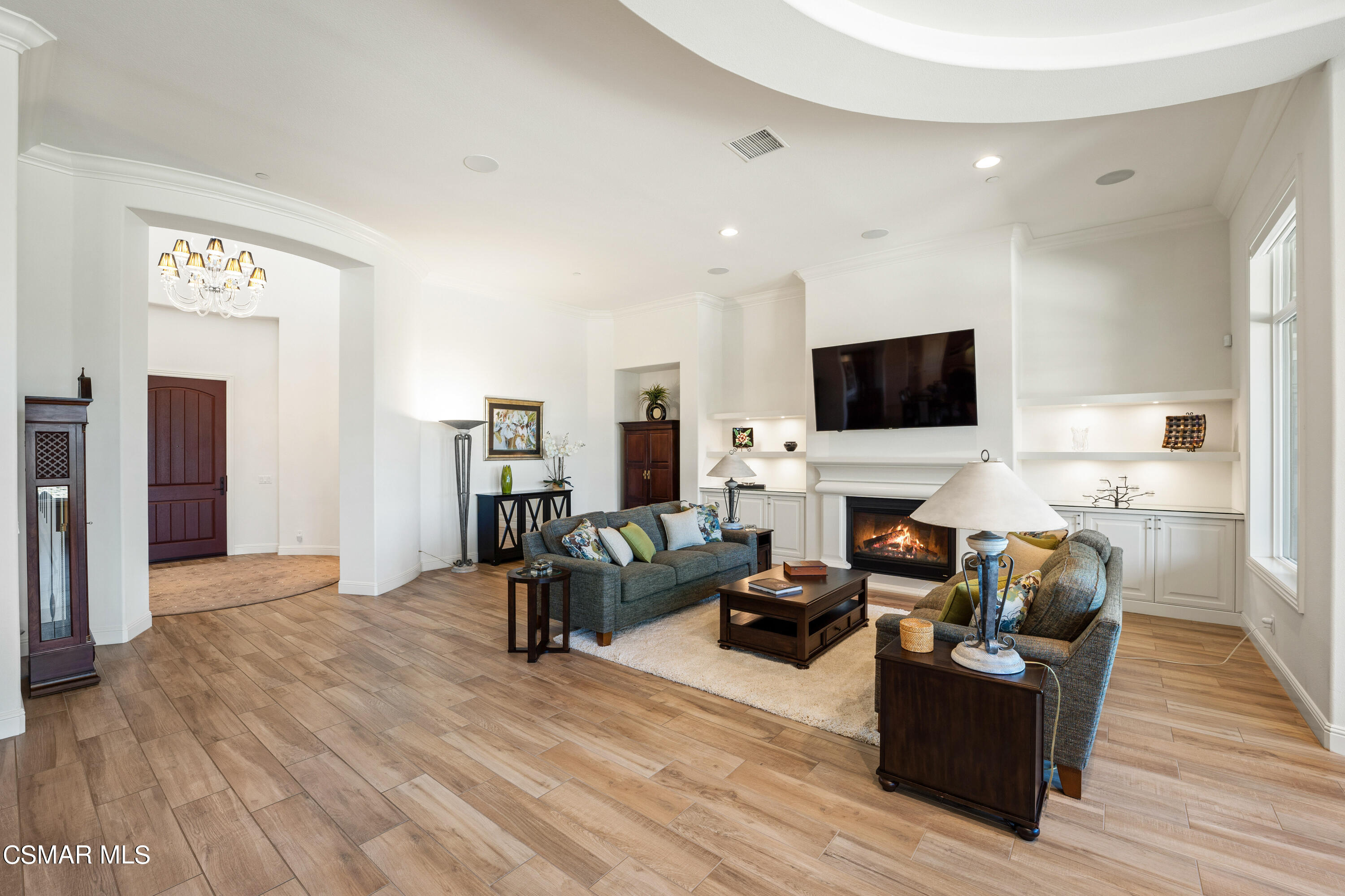 7343 Nicklaus Road Moorpark, CA 93021 - Photo 6 of 42 a living room with furniture and a flat screen tv