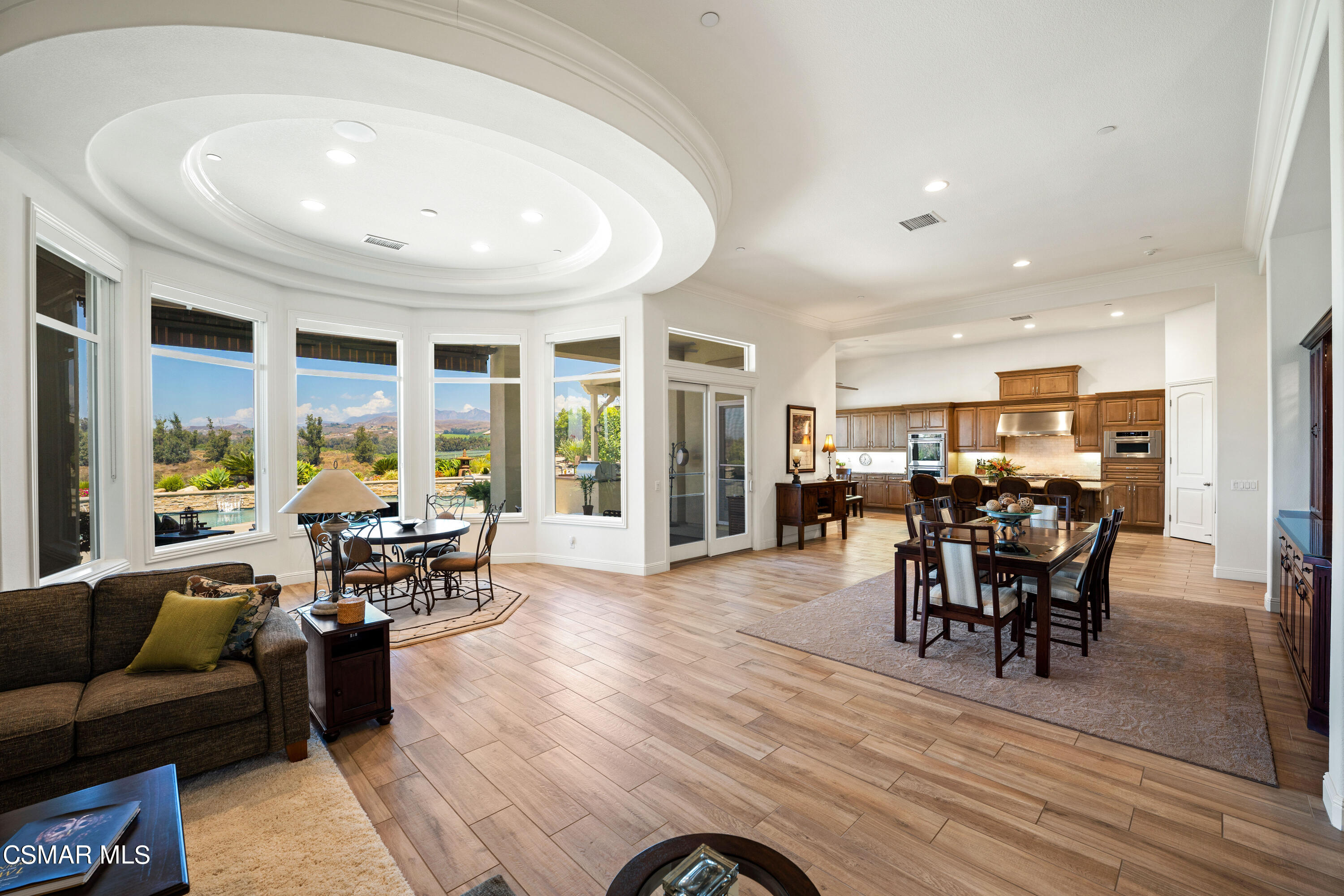 7343 Nicklaus Road Moorpark, CA 93021 - Photo 9 of 42 a dining room with furniture window and wooden floor