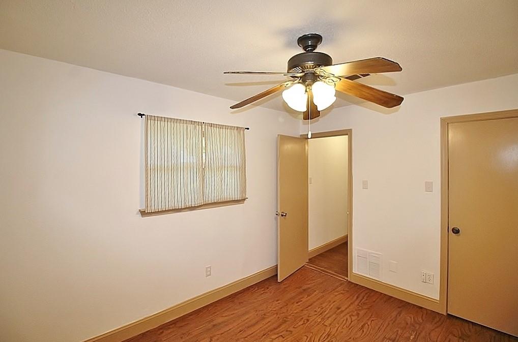 112 Trailwood Road Enchanted Oaks, TX 75156 - Photo 11 of 15 a view of a chandelier fan and a window