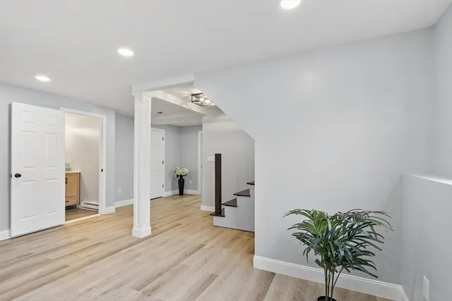 a view of kitchen with sink and refrigerator