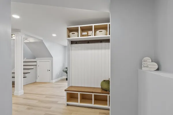 a living room with furniture and kitchen view