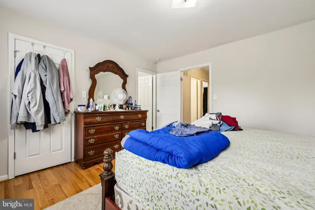 a bedroom with a bed and a dresser