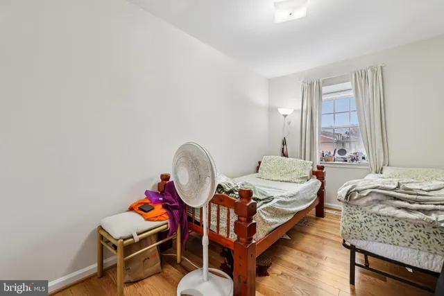 a bedroom with bed and a window