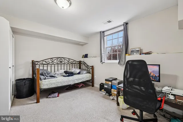 a view of a livingroom with furniture and windows