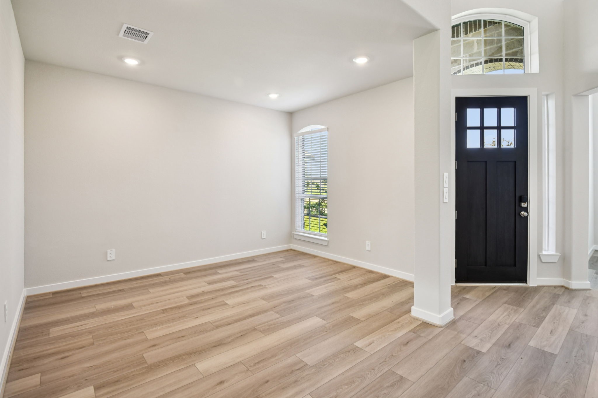 2843 Dark Lantern Drive Rosenberg, TX 77471 - Photo 11 of 49 wooden floor in an empty room with a window