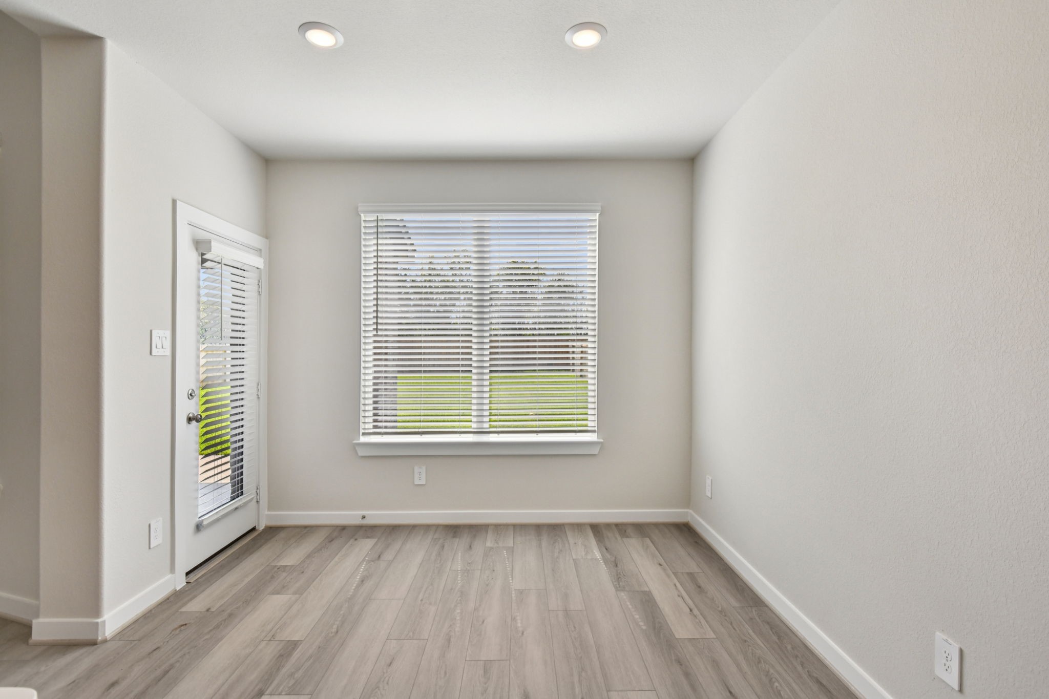 2843 Dark Lantern Drive Rosenberg, TX 77471 - Photo 12 of 49 an empty room with wooden floor and windows