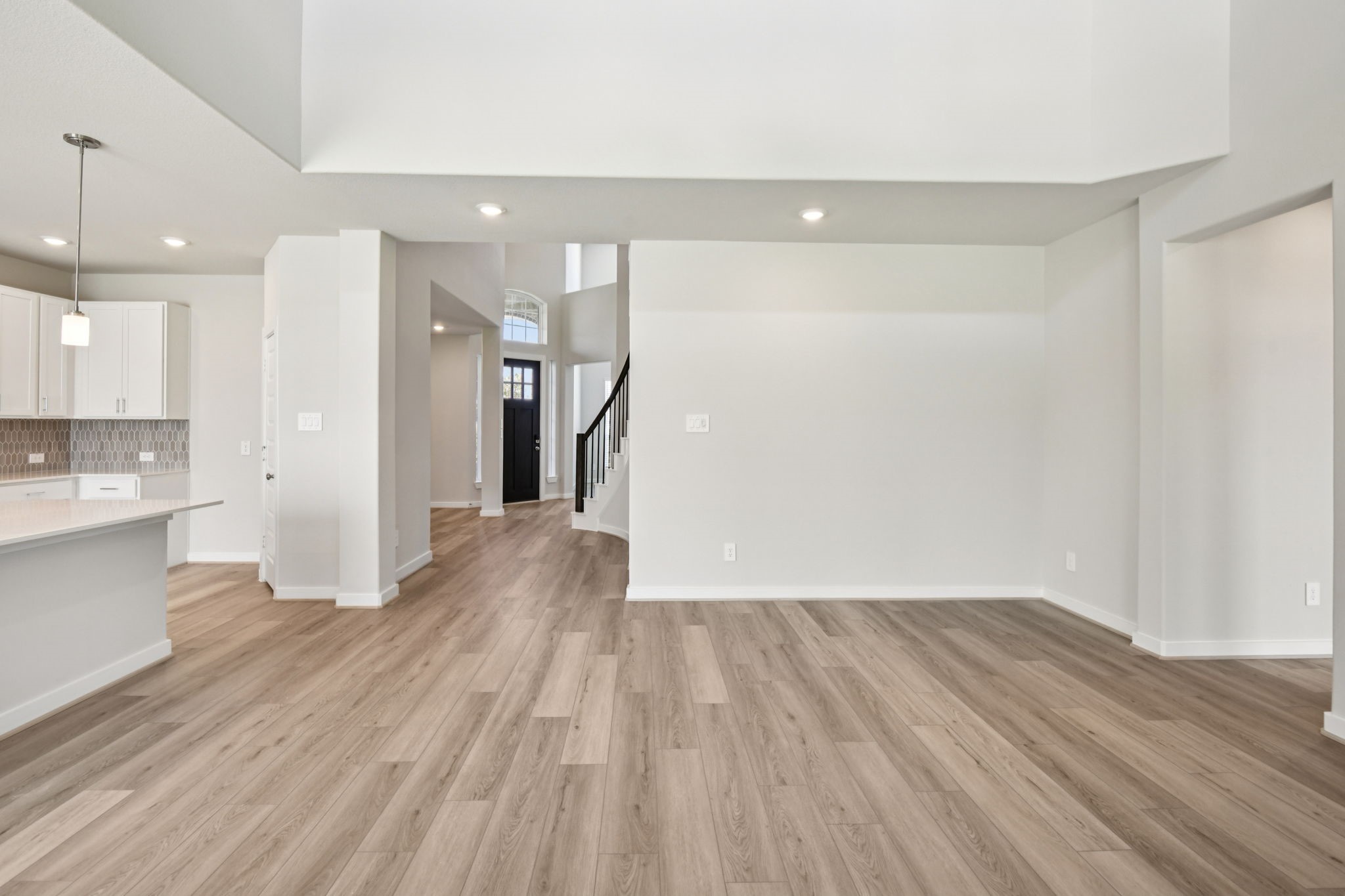 2843 Dark Lantern Drive Rosenberg, TX 77471 - Photo 7 of 49 a view of a room with wooden floor and a kitchen