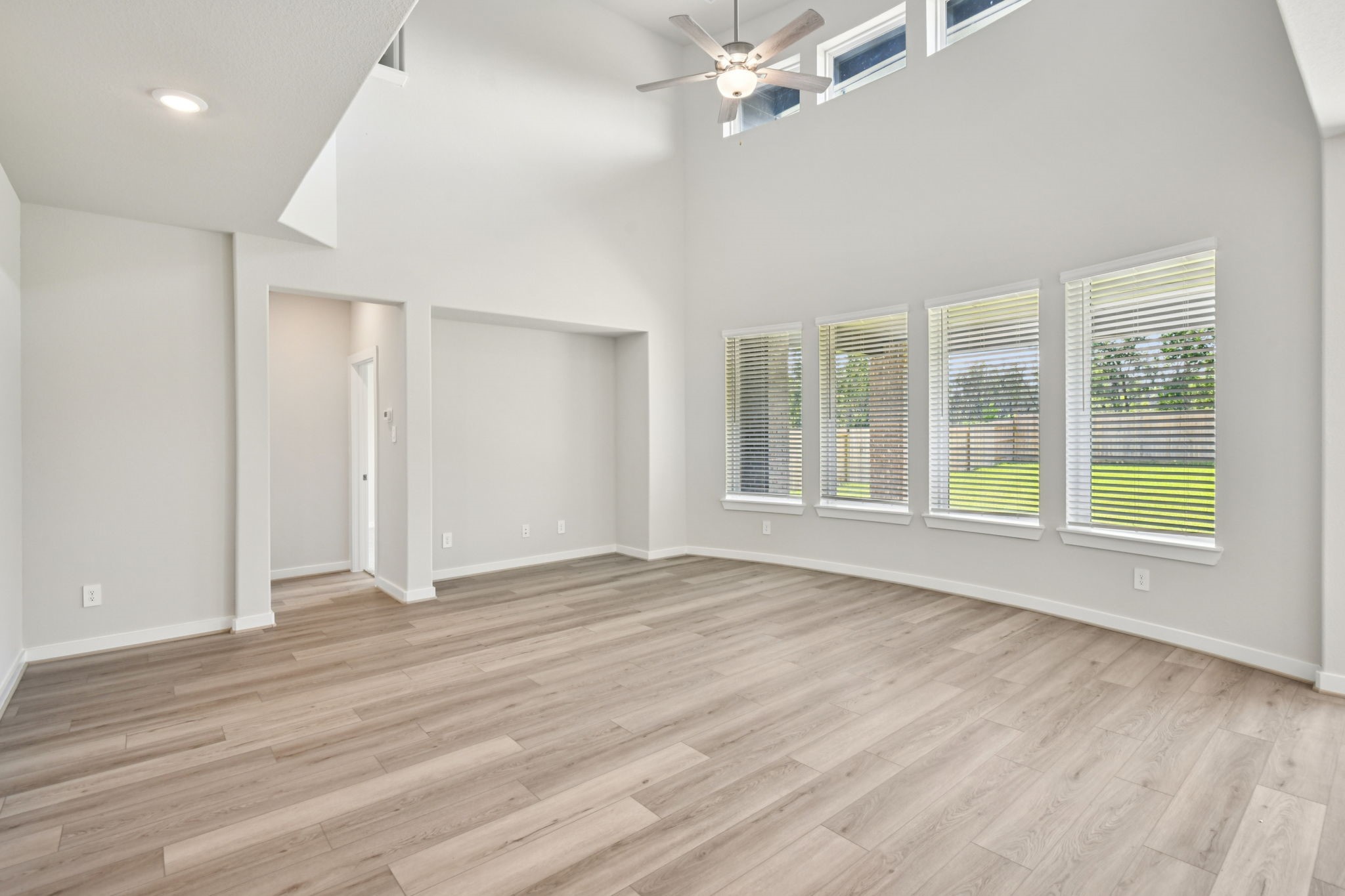 2843 Dark Lantern Drive Rosenberg, TX 77471 - Photo 8 of 49 a view of an empty room with wooden floor and a window