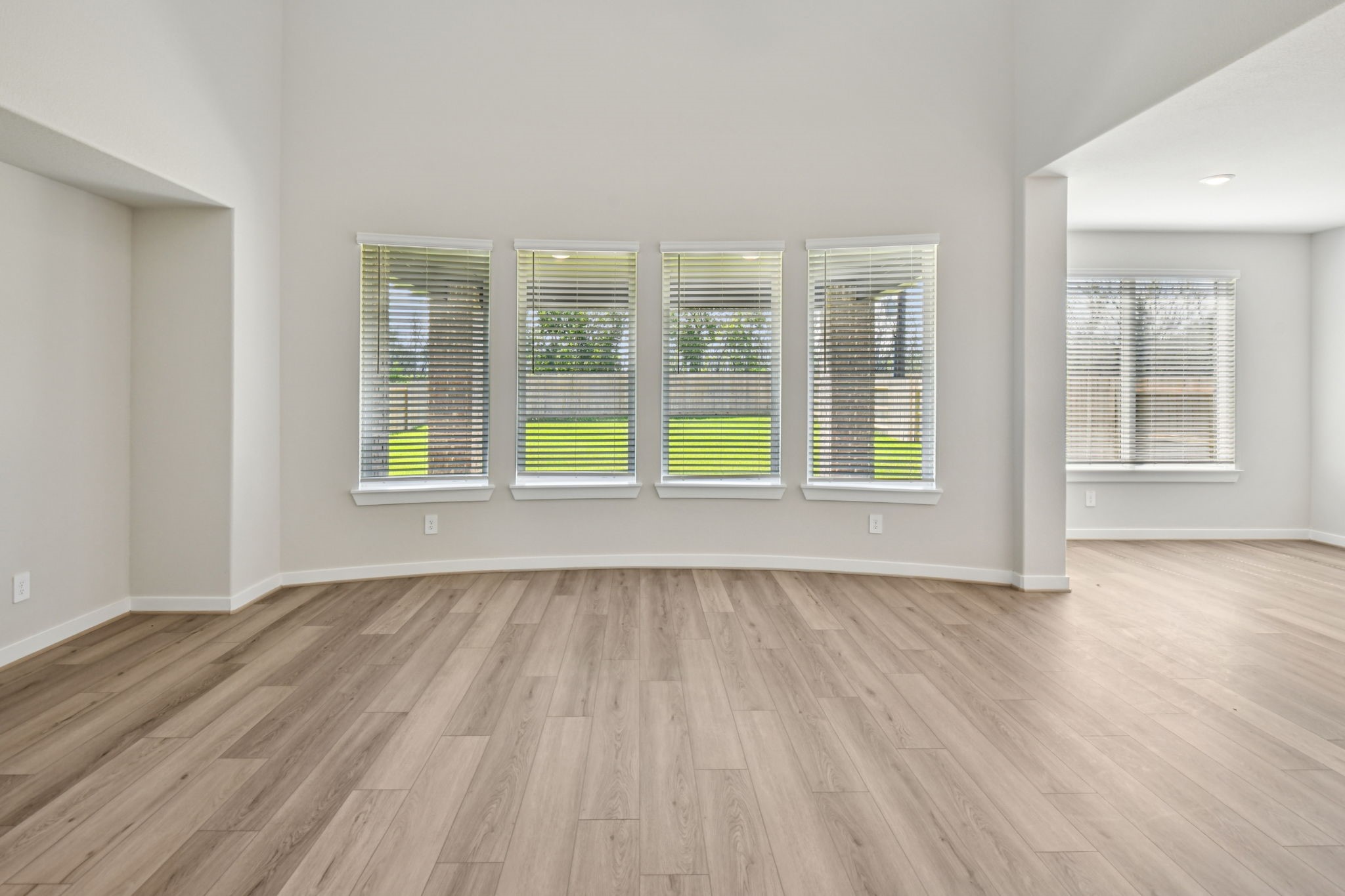 2843 Dark Lantern Drive Rosenberg, TX 77471 - Photo 9 of 49 a view of an empty room with wooden floor and a window