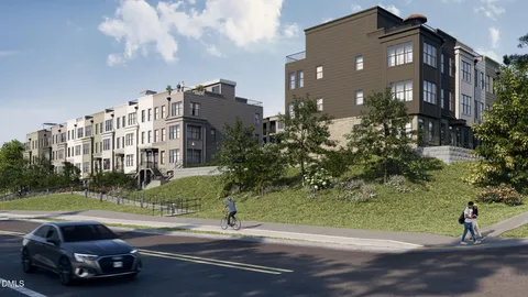 a view of multiple houses with a yard