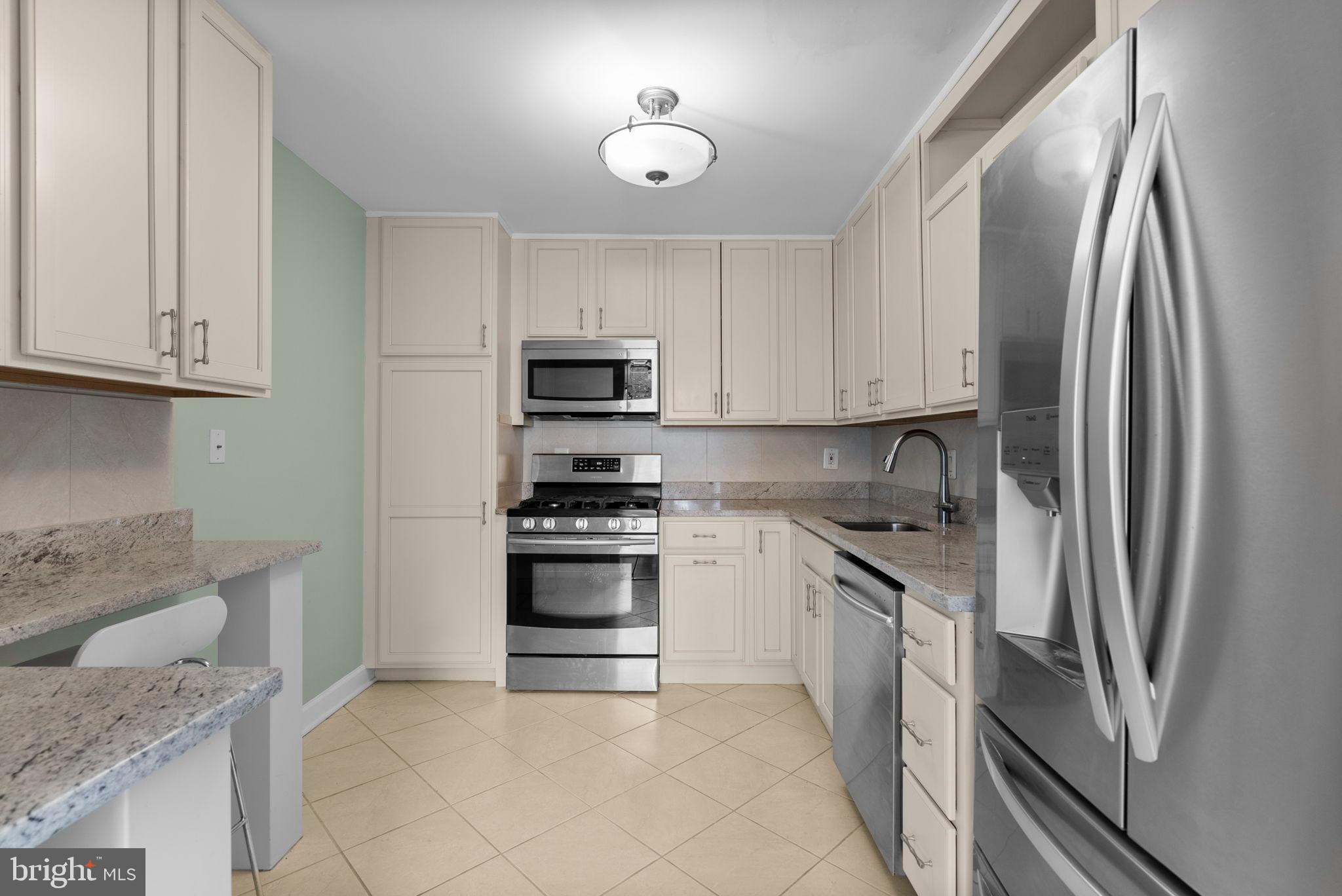 5225 Pooks Hill Road, Unit A24S Bethesda, MD 20814 - Photo 12 of 22 Modern kitchen with sleek appliances.