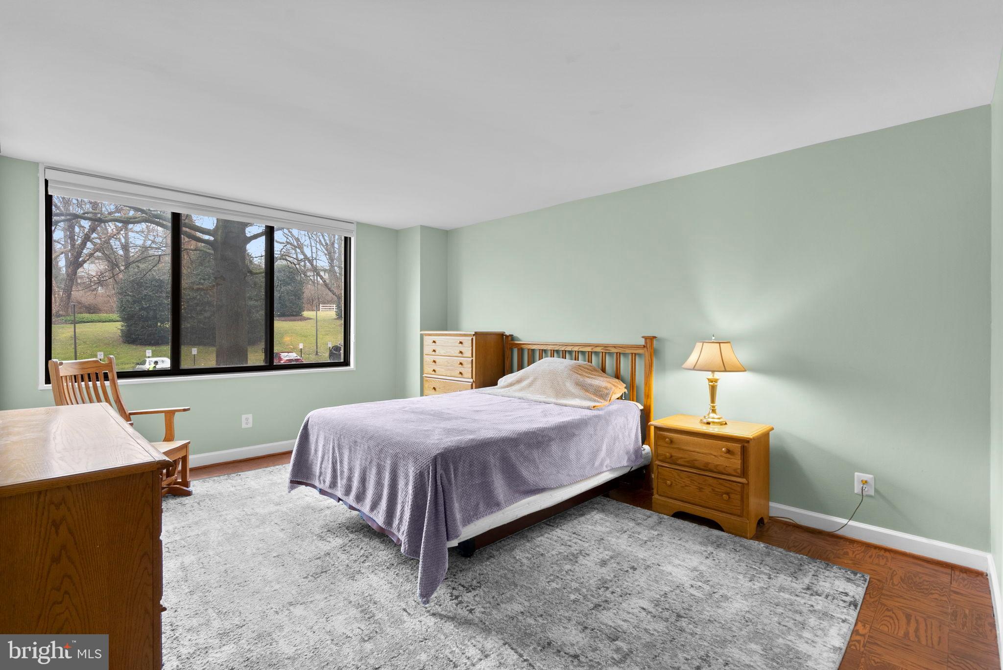 5225 Pooks Hill Road, Unit A24S Bethesda, MD 20814 - Photo 16 of 22 Serene bedroom with natural light and charm.
