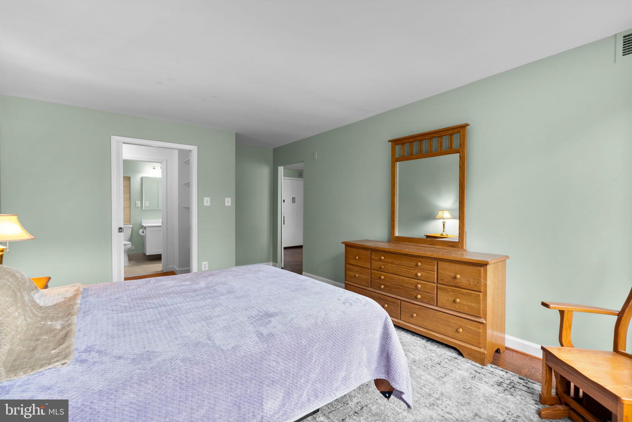 5225 Pooks Hill Road, Unit A24S Bethesda, MD 20814 - Photo 17 of 22 Serene bedroom with soft green hues.